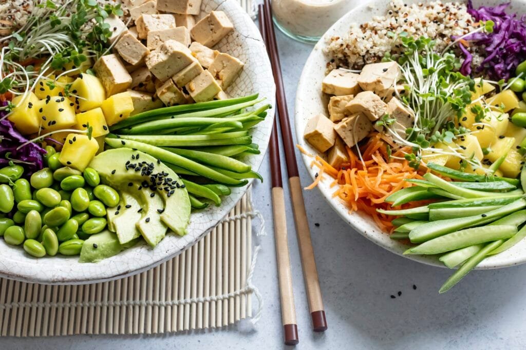 High protein vegetarian meal prep bowl with tofu quinoa edamame and vegetables